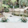 small water feature with florals set for a wedding ceremony