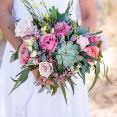 Custom wedding bouquet with pink flowers and succulents.