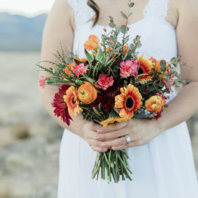 Custom wedding bouquet with orange and pink flowers