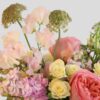 close up view of a flower arrangement of pink and yellow flowers