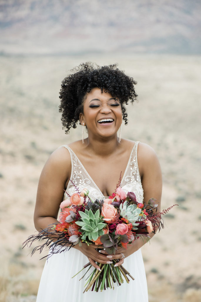 Bride with bouquet of eco-friendly flowers and succulents