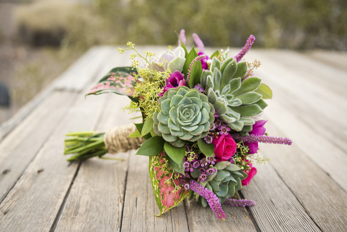 Succulent bouquet laying on a wooden table