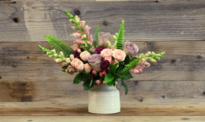 Mixed unique florals in ceramic vase.