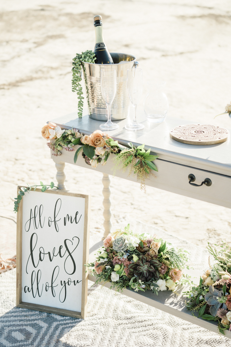 Florals on reception table.