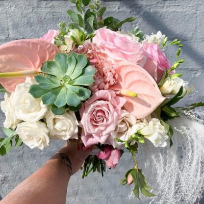 Succulent and rose wedding bouquet.