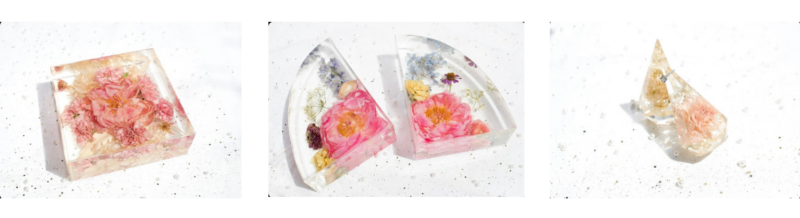 Wedding flowers preserved in acrylic structures as keepsakes.