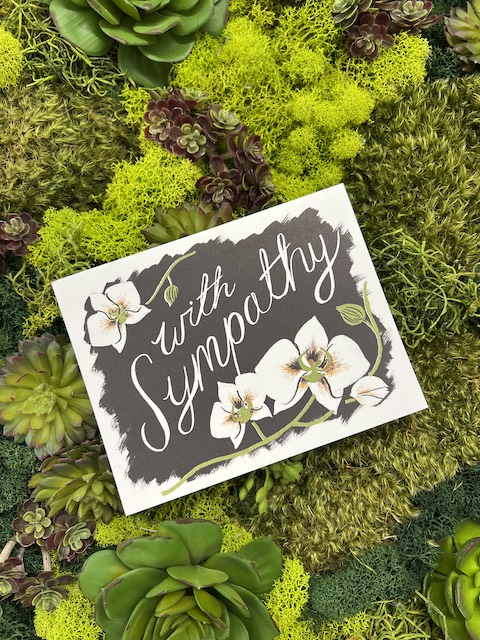 Illustrated sympathy card with the text "With Sympathy"?