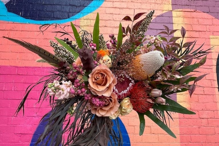Large, colorful fall wedding bouquet.