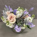 Wedding flowers for the table in pinks and purples.
