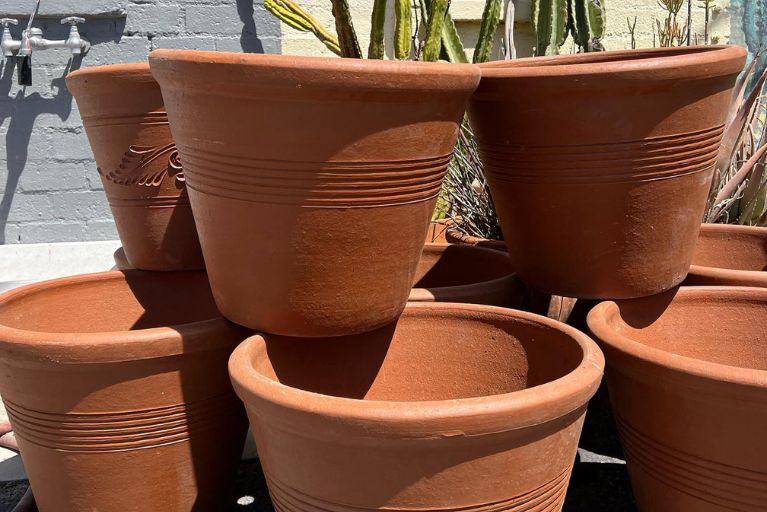 stack of large terra cotta pots