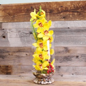yellow orchids in a glass vase