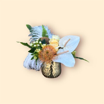 desert theme flower bouquet in white and yellow flowers with a gold vase